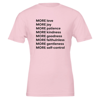 Pink t-shirt with motivational text on a white background