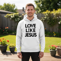Man wearing a white hoodie with 'Love Like Jesus' text in a garden setting