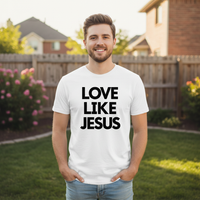 Man wearing a white t-shirt with 'LOVE LIKE JESUS' text in a backyard setting