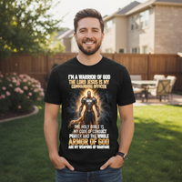 Man wearing a black t-shirt with religious text and graphic in a backyard setting